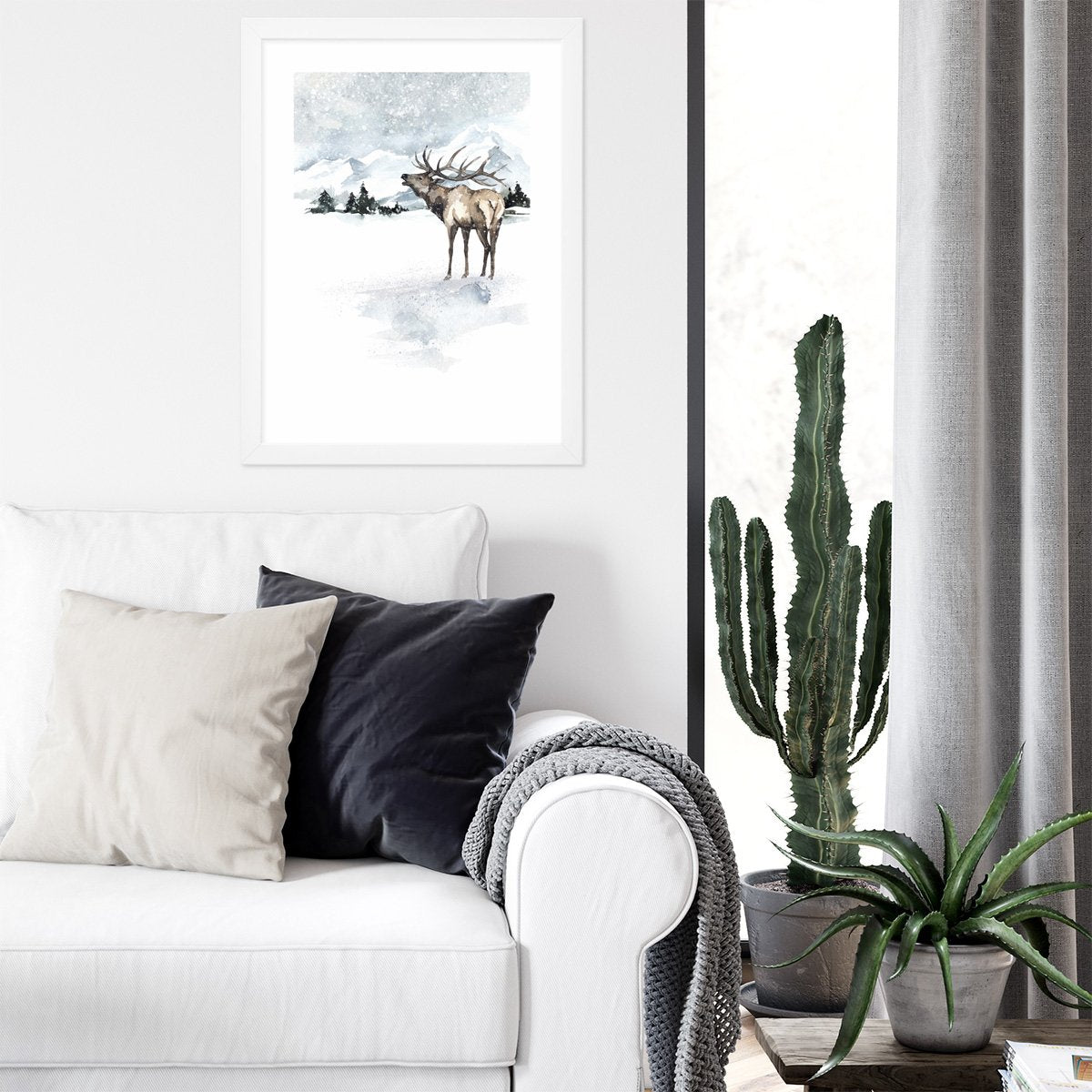 Plakat do salonu z jeleniem na tle gór w białej ramie