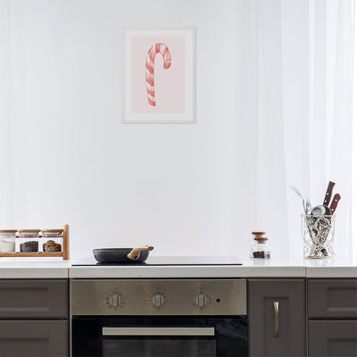 Plakat na ścianę do kuchni z lizakiem laską na różowym tle